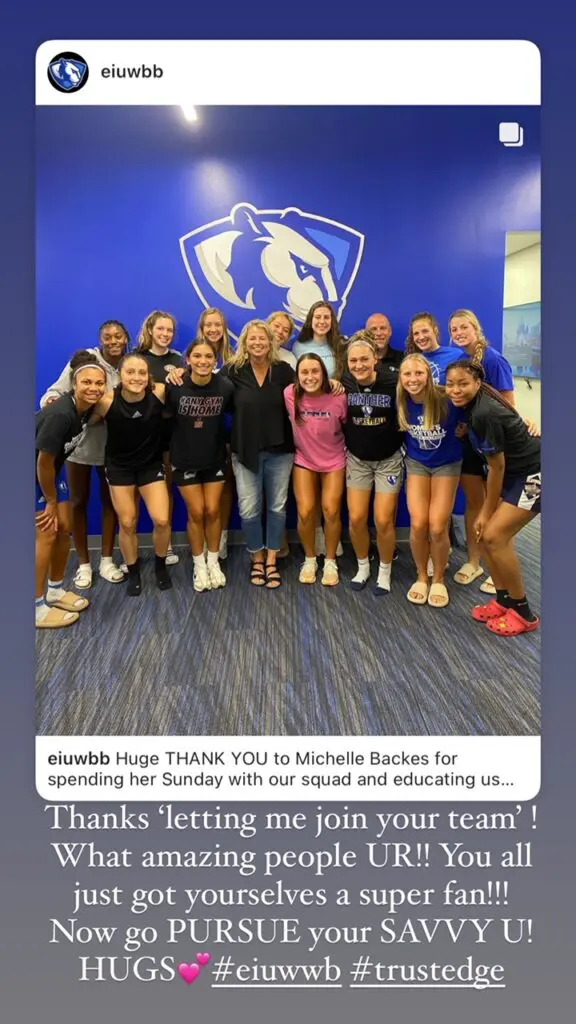Group of people posing in sports attire.