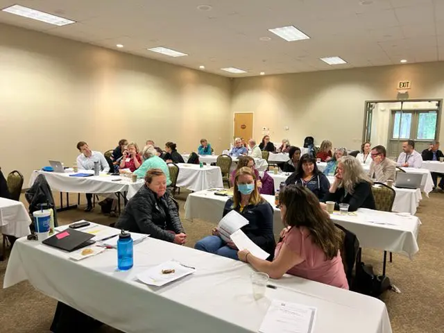 People attending a conference or workshop session.