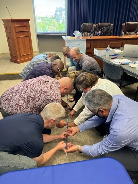 Group collaborating on a team-building exercise.