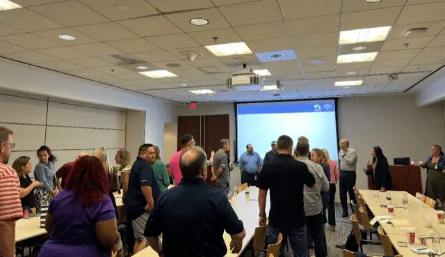 People gathered in a conference room meeting.