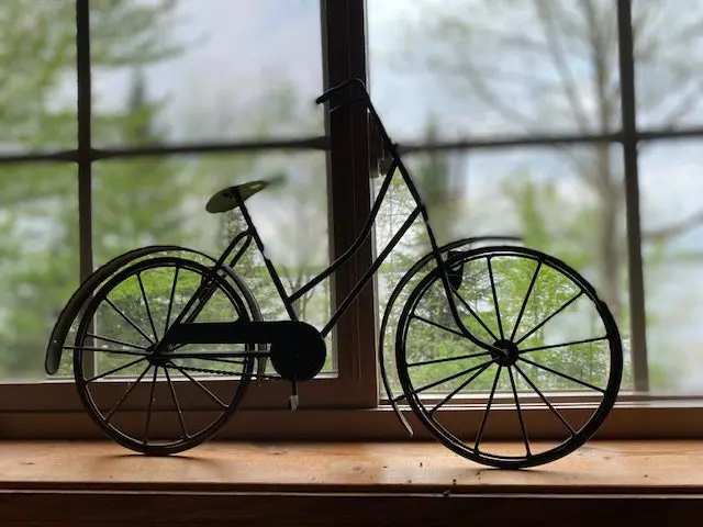 Bicycle silhouette on a windowsill.
