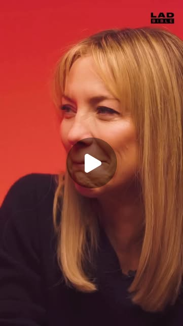 Smiling woman with long blonde hair against a red background.