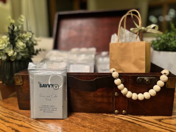 A wooden box with some paper bags and a bag of coffee